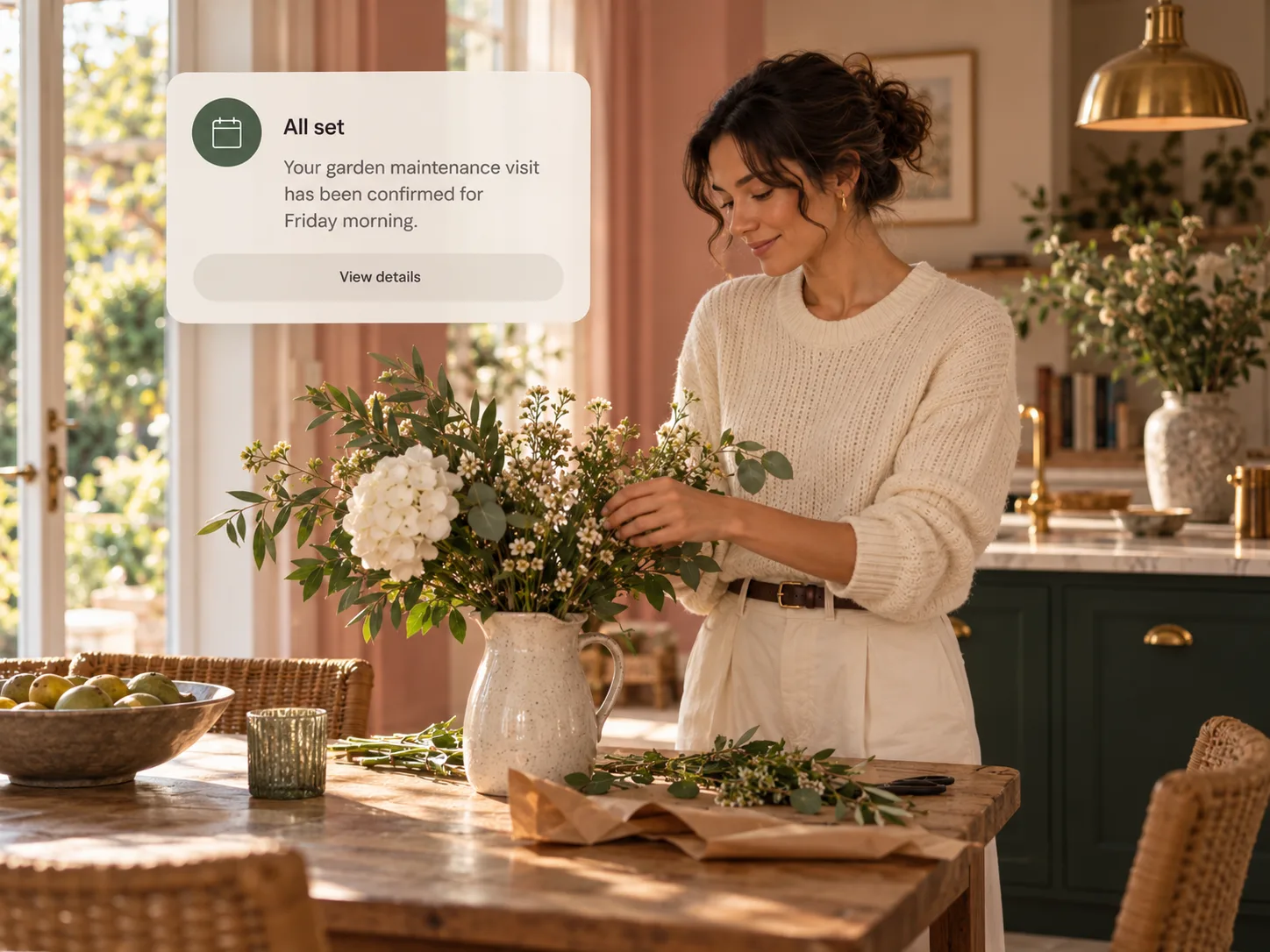 A woman arranging flowers while a note confirms the next garden visit is booked for Friday.